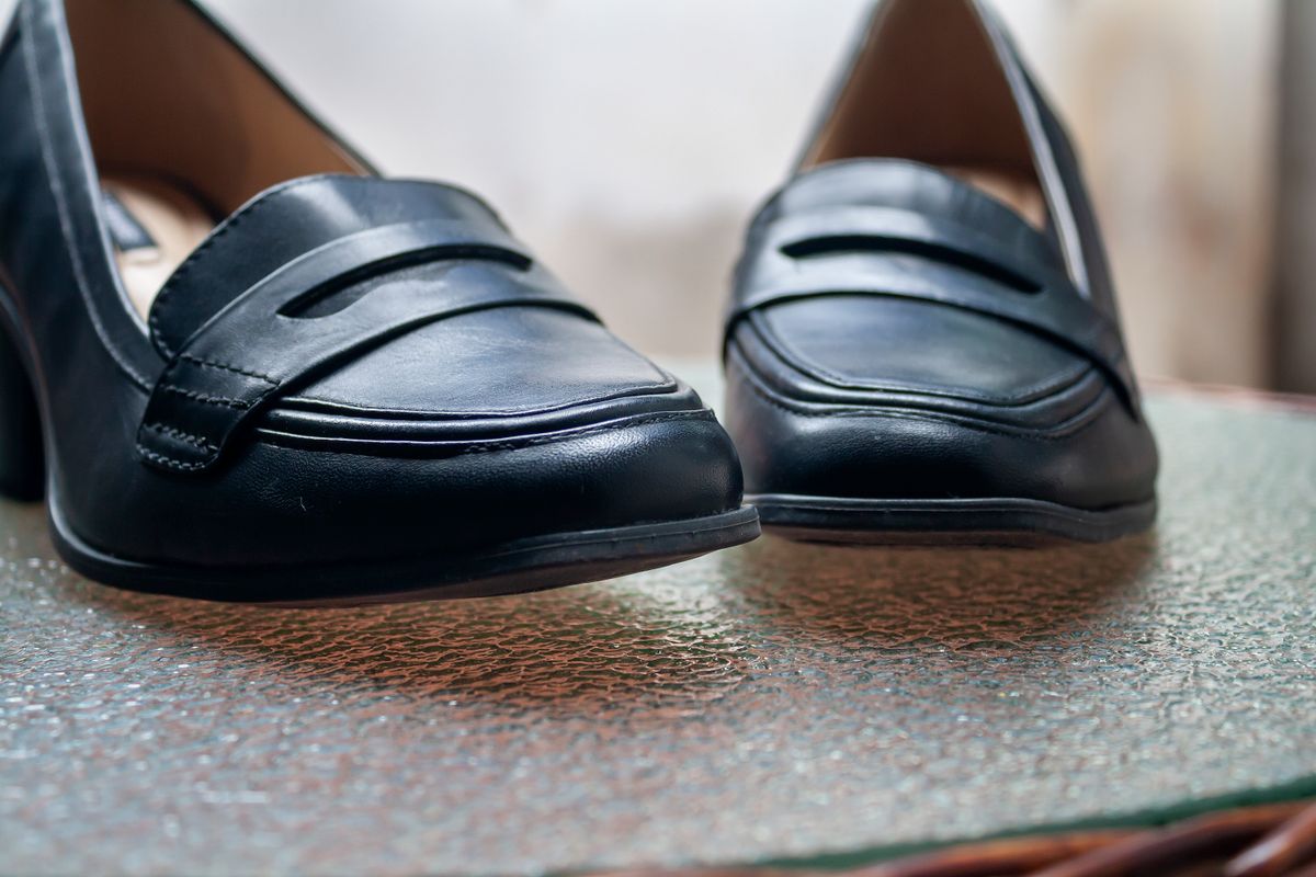 Close-up of navy leather penny loafers