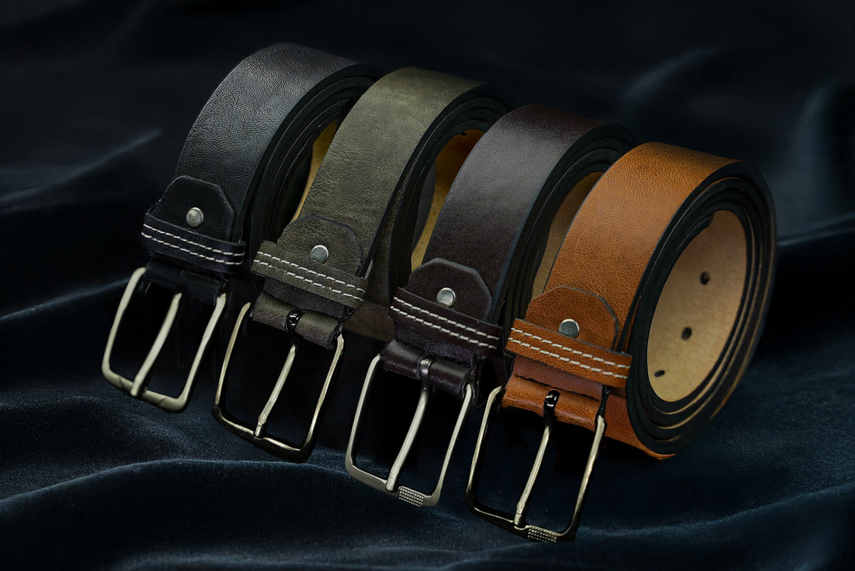 Four leather belts in black, gray, and brown